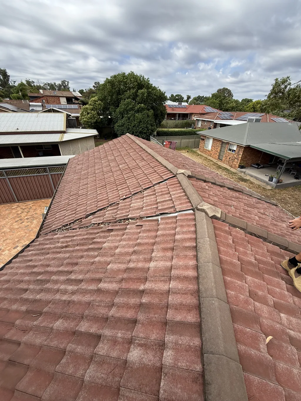 Roof repair with new flashing sealed around a roof penetration