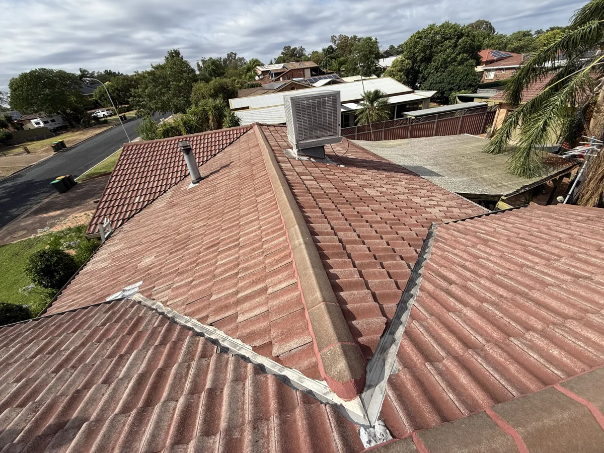 Repaired ridge and valley on a tiled roof in Dubbo