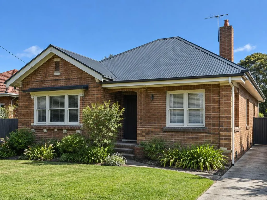 Brick home with a charcoal metal roof in regional NSW